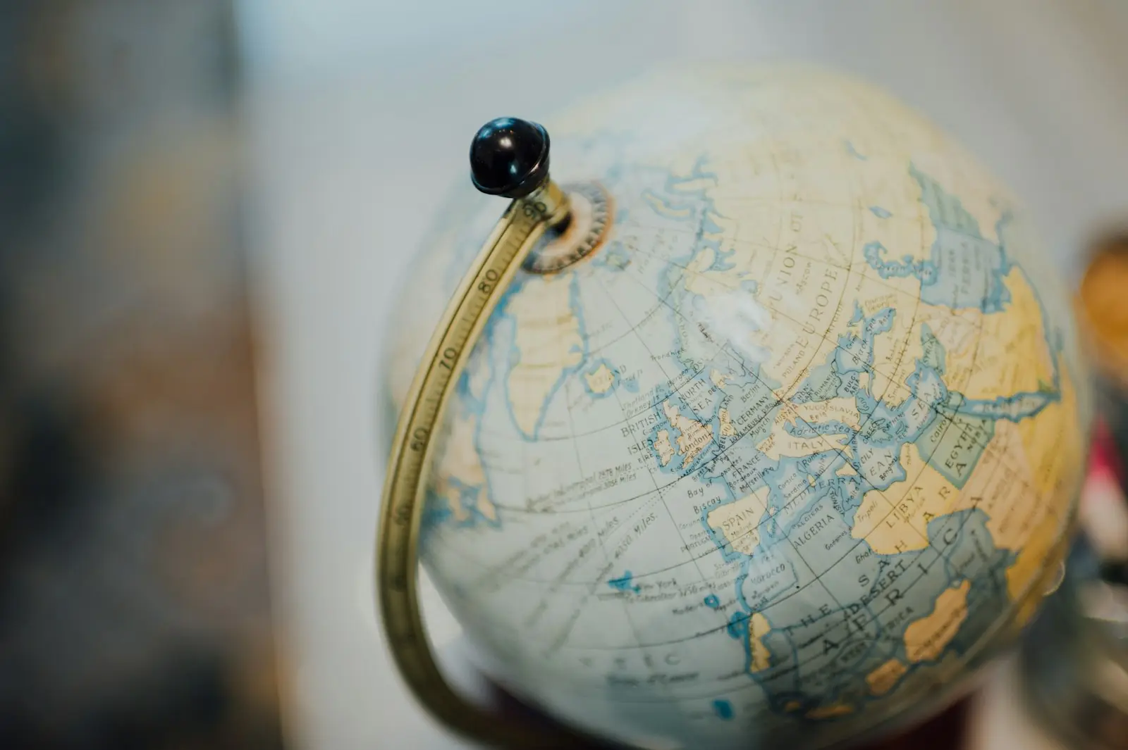 A gold desk globe